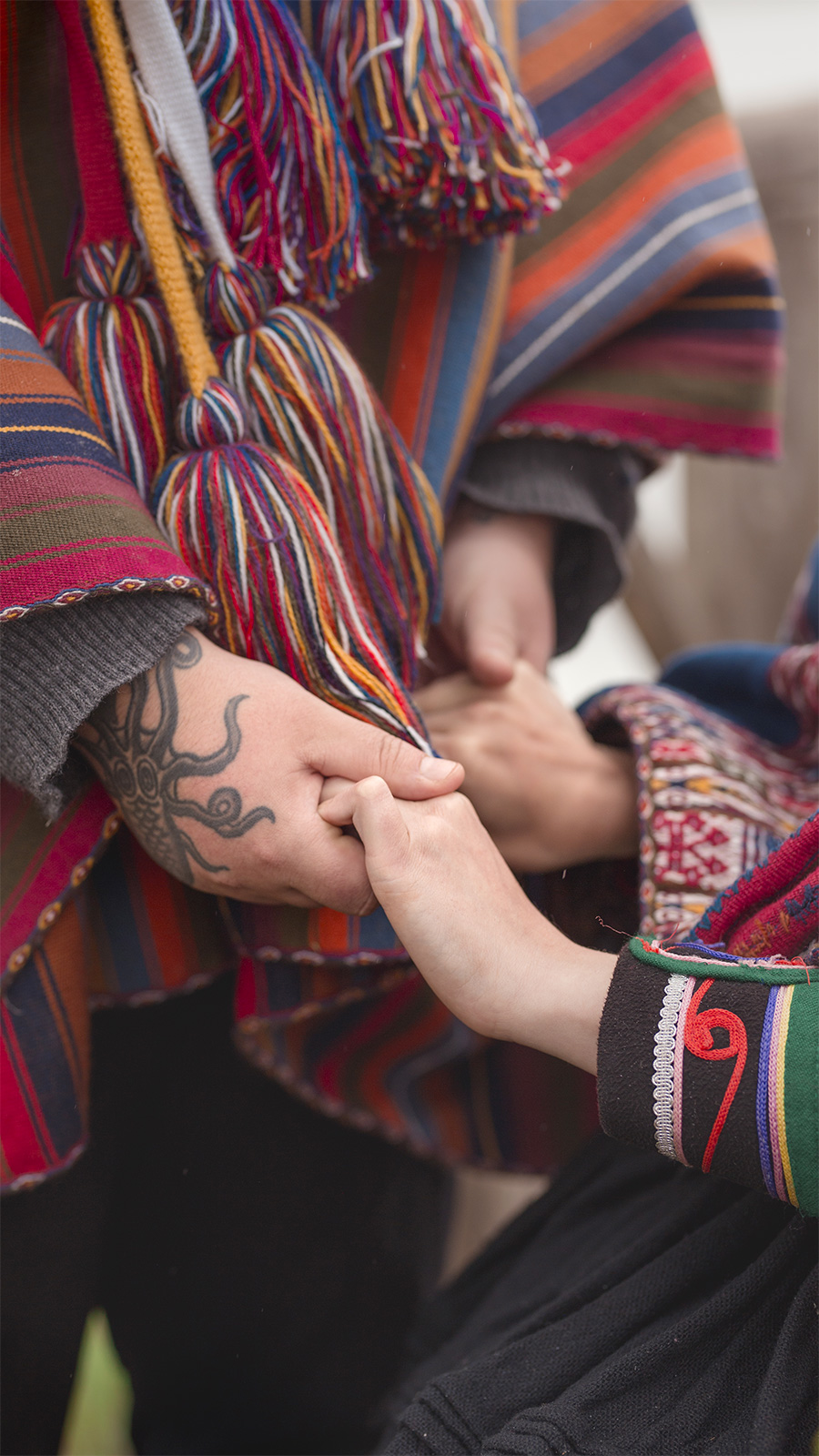 andean wedding mayara & andre hands holding chincheros cusco photo by lorenna martin